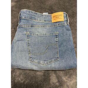 Levi's ultra stretch, totally shaping blue jeans with a 35” waist and 32" inseam
